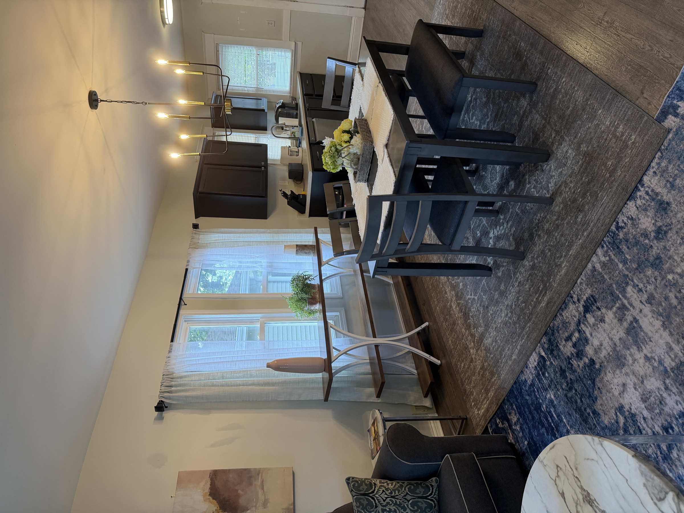 Dining area with kitchen beyond